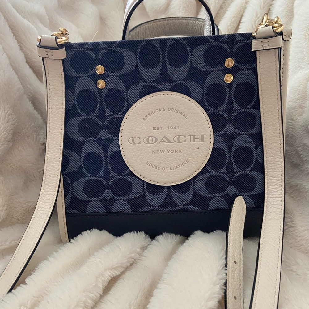 Slightly used Coach Dempsey 22 bag.